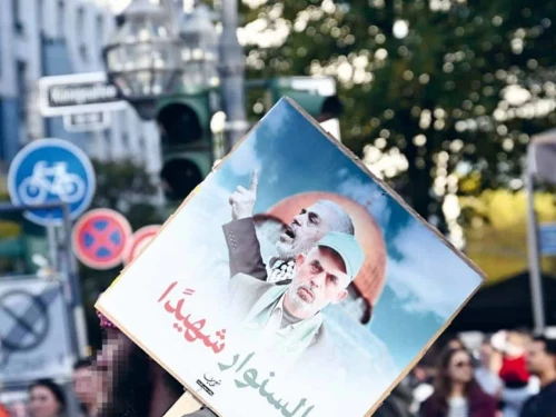 Protesters at an anti-Israel rally in Dusseldorf, Germany, hold up a poster celebrating slain Hamas senior leader Yahya Sinwar, October 2024. Credit: RIAS Berlin Commission.