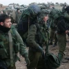 Israeli infantry reservists prepare to cross into the Gaza Strip, at a deployment area near the Israeli-Gaza border, Jan. 12, 2009. Credit: Roni Schutzer/Flash90.