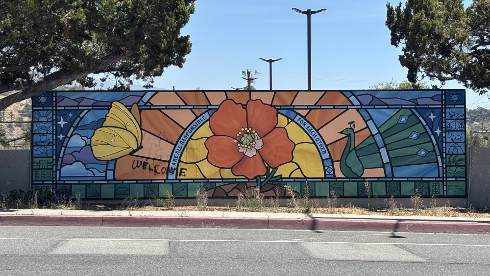 Antisemitic graffiti partially cleaned off a community mural at the site of the Pasadena Jewish Temple and Center, in Pasadena, Calif., on July 27, 2026. Photo by Aaron Bandler.