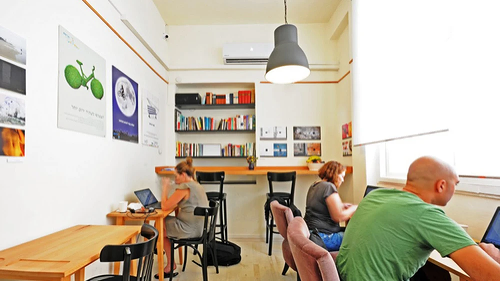 "Misanthrope," a shared workspace in Tel Aviv that is a haven for Israeli writers. In return for a small hourly fee, Misanthrope customers enjoy unlimited free coffee, fresh fruit, WiFi, and a comfortable public quiet space to work on personal projects. Credit: Courtesy.