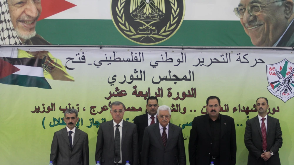 Palestinian leader Mahmoud Abbas (center) delivers a statement at a conference in Ramallah on Oct. 18, 2014. Photo by Flash90.