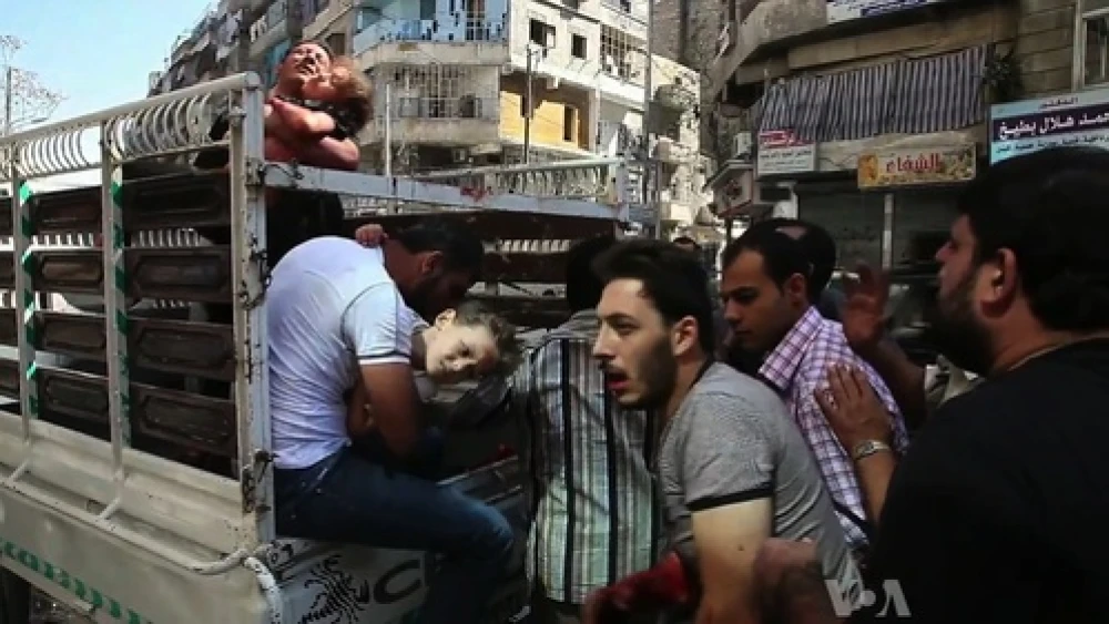Wounded civilians arrive at a hospital in Aleppo during the Syrian civil war. Credit: Voice of America News/Scott Bob via Wikimedia Commons.