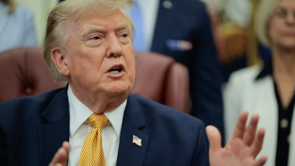 U.S. President Donald Trump speaks to the media after signing an executive order establishing the President's Military Spouse Commission in the Oval Office at the White House, Washington, DC.,  Aug. 3, 2026. Photo by Chip Somodevilla/Getty Images.