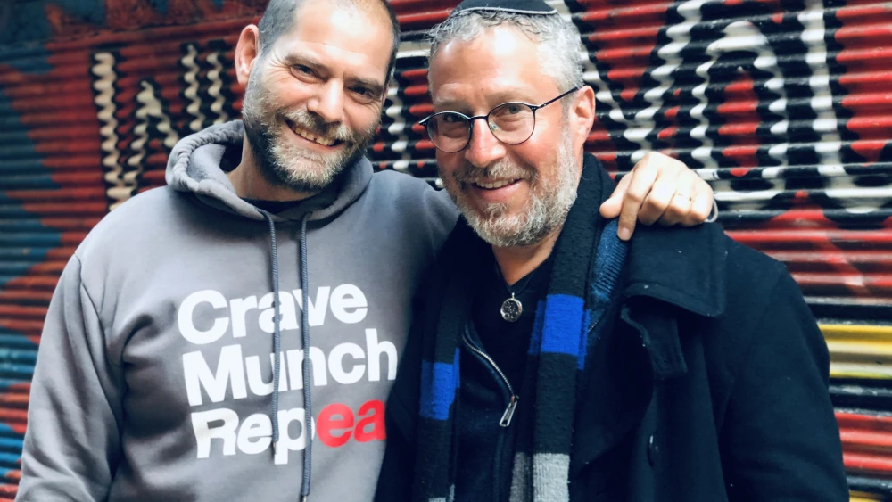 Yoni Van Leeuwen and Tzvi Maller, co-owners of Crave Gourmet Street Food in Jerusalem's Machane Yehuda market. Photo by Eliana Rudee.