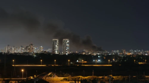 Smoke over Tel Aviv as more than 130 rockets were fired from the Gaza Strip into central Israel on May 11, 2021. Photo by Matanya Tausig/Flash90.