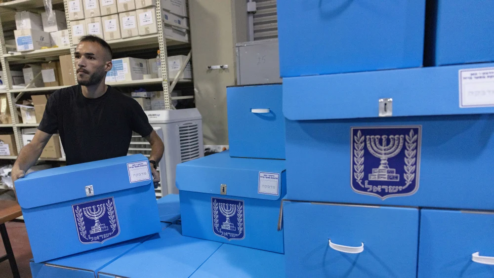 Workers prepare ballot boxes for Israel’s upcoming general elections at the Central Elections Committee warehouse in Shoham, ahead of their distribution to polling stations across the country, Oct. 14, 2026. Photo by Yonatan Sindel/Flash90.