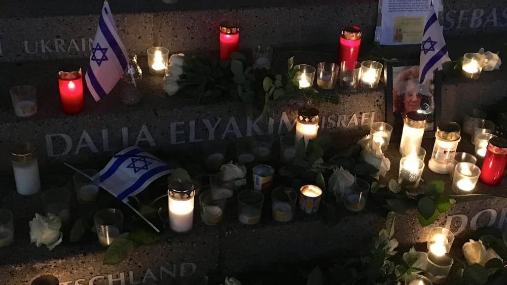 Israeli flags surround the name of Dalia Elyakim, an Israeli woman killed in the 2016 Berlin Christmas market terror attack, within a memorial to the attack's 12 victims. Credit: Orit Arfa.