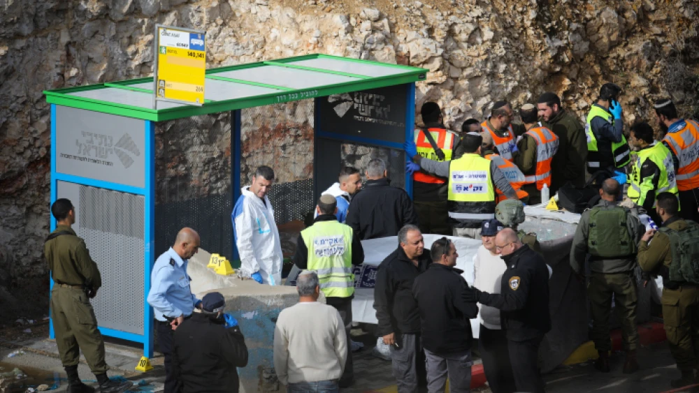 Israeli soldiers and police inspect the scene of a shooting attack at the entrance to the Israeli settlement of Givat Asaf in the West Bank on Dec. 13, 2018. Photo by Hadas Parush/Flash90.