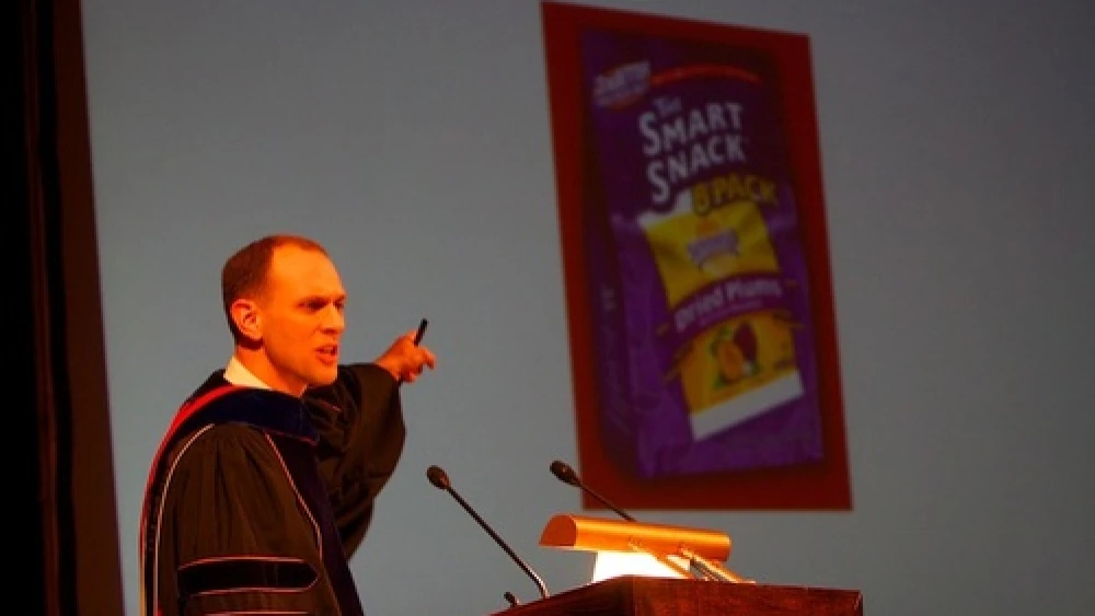 University of Chicago professor Austan Goolsbee (recently, the chair of the Council of Economic Advisers) looks at the hamantash-latke issue from an economics point of view during the school's debate in 2007. Credit: Courtesy of Daniel J. Libenson.