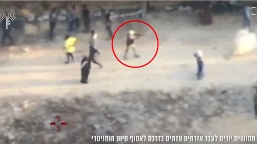 A screen capture from a video released Sunday, reportedly showing a Gazan gunman firing at civilians in Khan Yunis on June 1, 2025. Screenshot: IDF Spokesperson's Unit.