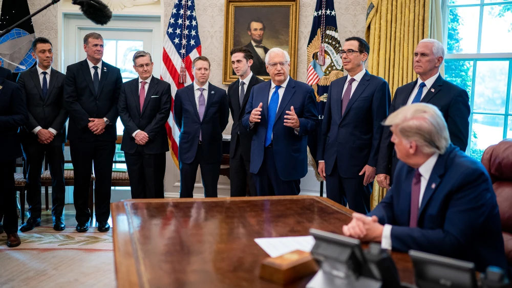 Then-U.S. President Donald Trump listens as U.S. Ambassador to Israel David Friedman delivers remarks during the announcement of normalization of relations between Israel and Bahrain in the Oval Office of the White House, Sept. 11, 2020. Photo by Tia Dufour/The White House.