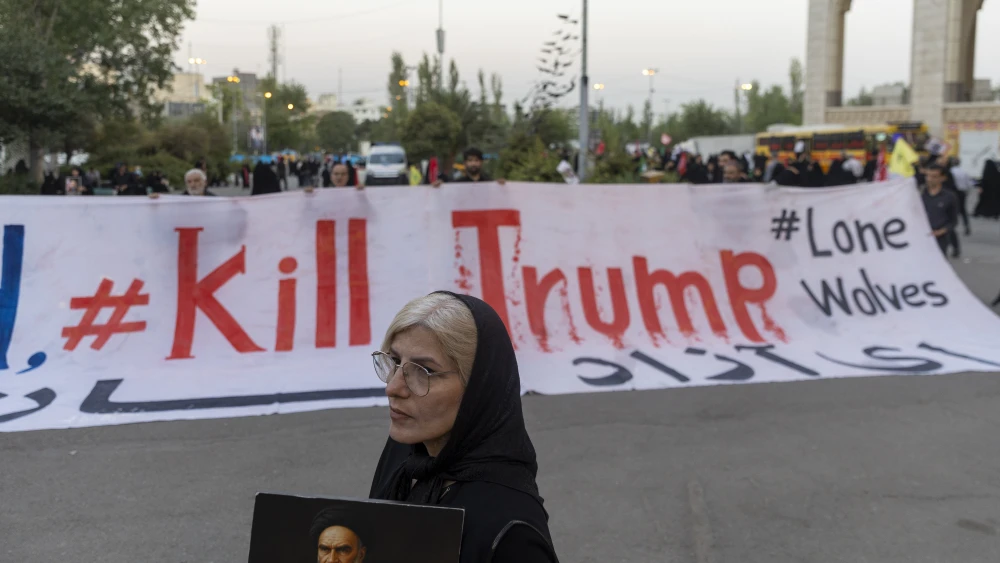 Iranian regime supporters hold a banner reading "Kill Trump" as they pay their respects to slain Supreme Leader Ali Khamenei at the Imam Khomeini Grand Mosque in Tehran, July 14, 2026. Photo by Majid Saeedi/Getty Images.