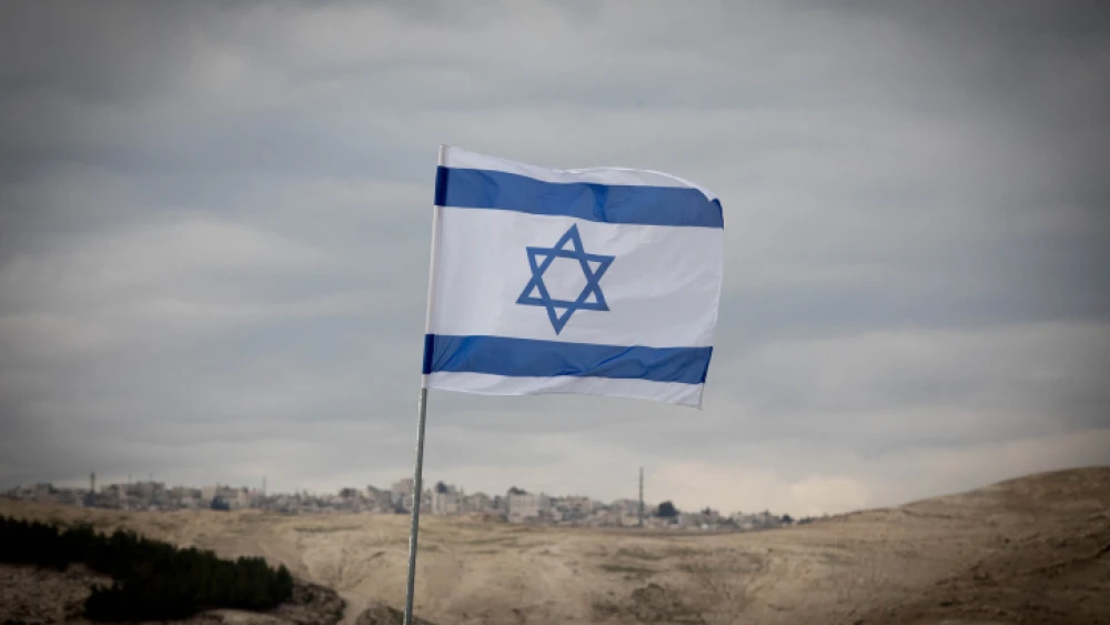 View of the Israeli flag and the area known as E1 on Jan. 2, 2017. Photo by Yonatan Sindel/Flash90.