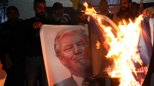 Palestinians burn posters depicting U.S. President Donald Trump during a protest against the Mideast peace plan, in the P.A.-controlled city of Bethlehem, Jan. 27, 2020. Photo by Wisam Hashlamoun/Flash90.