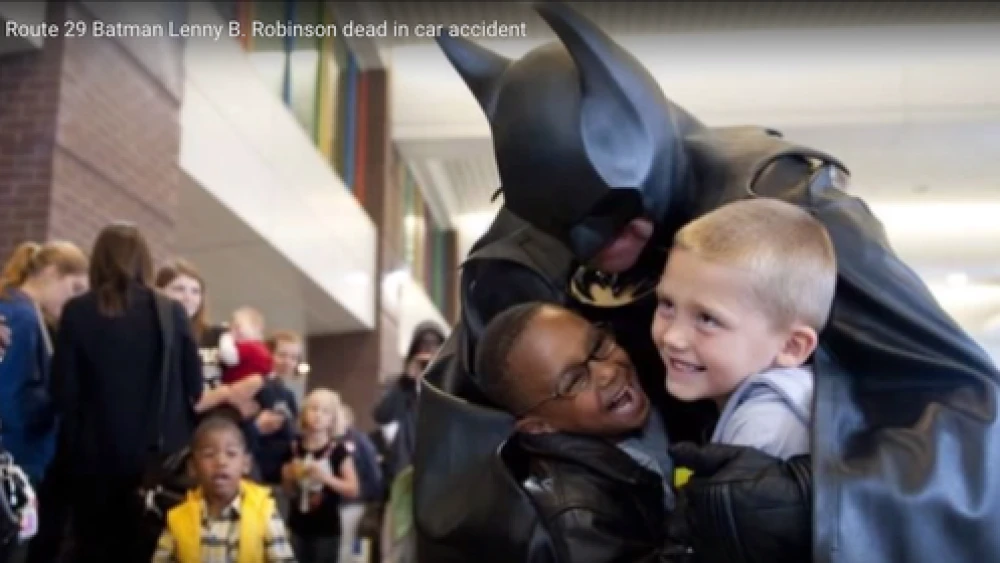 Click photo to download. Caption: The late Leonard "Lenny" Robinson would dress in a Batman costume and visit pediatric wards in the Baltimore and Washington, DC areas. Credit: YouTube screenshot.
