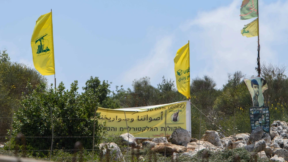 Hezbollah flags just over the border in Lebanon, July 3, 2022. Photo by Ayal Margolin/Flash90.