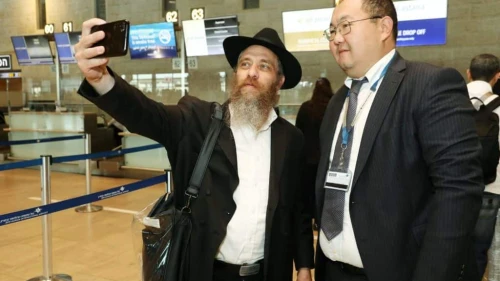 Israeli passengers at Tel Aviv's Ben-Gurion International Airport celebrate with Air Astana staff the inaugural direct flight between Israel and Kazakhstan on Sept. 7, 2023. Photo by Gideon Markowicz/TPS.