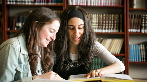 Young women taking part in program sponsored by the Orthodox Union that seeks to pair a a female member of a synagogue's staff with a teen to learn. Credit Orthodox Union.