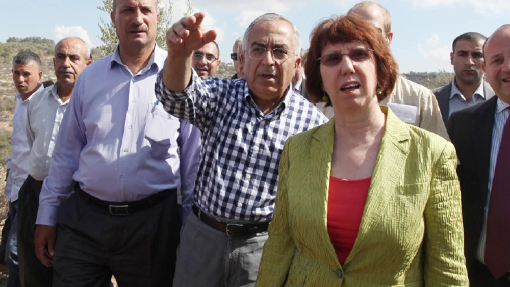 Palestinian Authority Prime Minister Salam Fayyad and E.U. foreign-policy chief Catherine Ashton in the village of Ras Karkar near Ramallah, on Oct. 25, 2012. Photo by Issam Rimawi/Flash90.