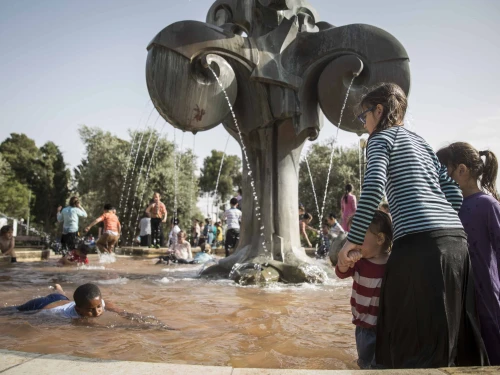 Israeli children play in a water fountain in Jerusalem on a hot day, May 25, 2015. Photo by Hadas Parush/Flash90.