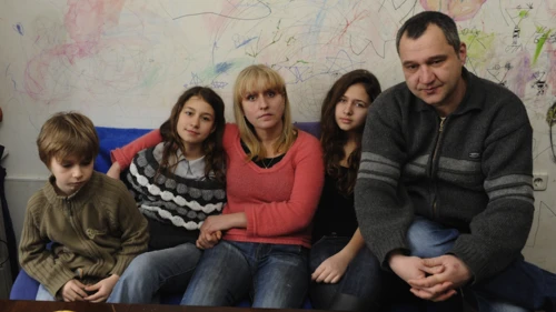 Click photo to download. Caption: With no money to replace the decayed wallpaper in their poorly insulated three-room apartment in Bulgaria, parents Harry and Yana allowed their three children to simply draw on the walls to bring cheer to their home. Economic hardships afflicting Europe pose a dire a threat to Jews, writes Alan H. Gill, CEO of the American Jewish Joint Distribution Committee (JDC). Credit: JDC.