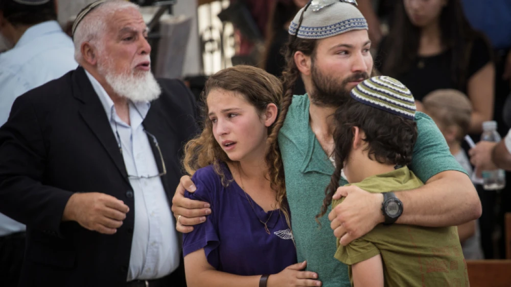 Children of Rabbi Michael Mark mourn at a service prior to his funeral at the Otniel yeshiva, of which Rabbi Mark was director, July 03, 2016. Photo by Hadas Parush/Flash90.