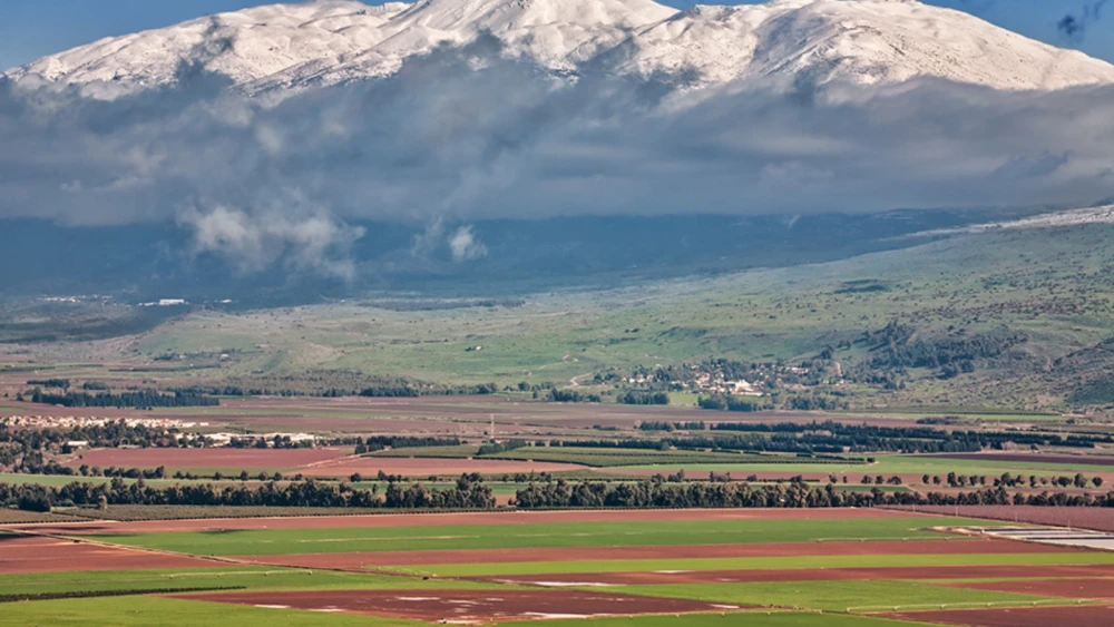 The Hula Valley with the snowcapped Mount Hermon in the distance. Photo by Noam Chen.