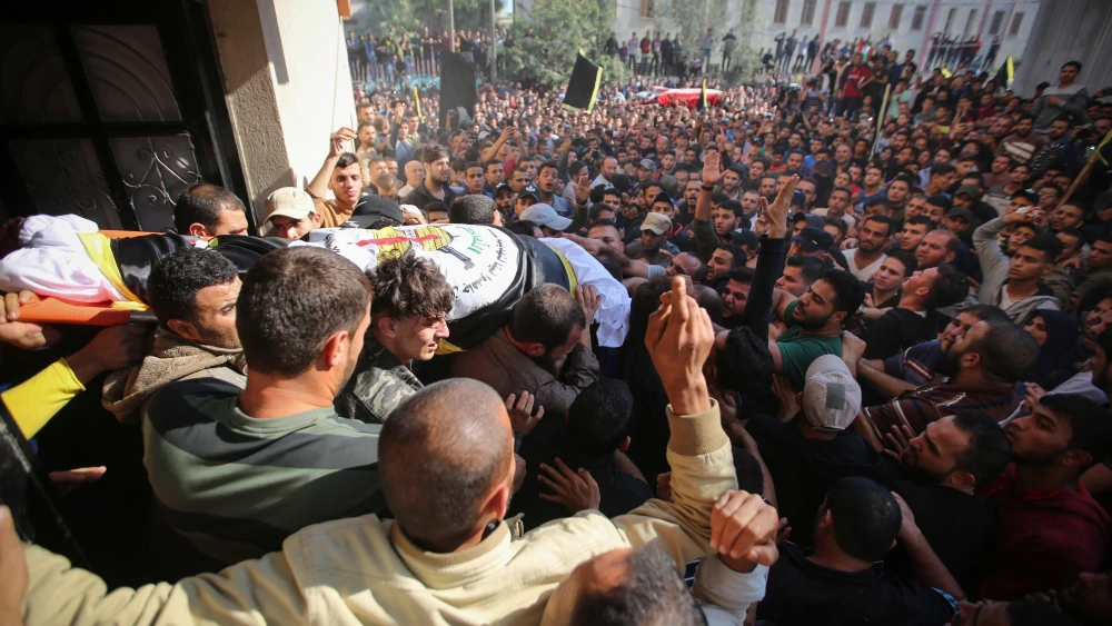 Mourners carry the body of Palestinian Islamic Jihad terrorist field commander Baha Abu al-Ata during his funeral in Gaza City after he was killed by an Israeli airstrike in a targeted attack on Nov. 12, 2019. Photo by Hassan Jedi/Flash90.