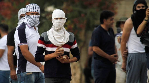 Palestinian protesters clash with Israeli forces, in the village of Kfar Qaddum, near Nablus, on Oct. 12, 2018. Photo by Nasser Ishtayeh/Flash90.