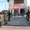 Fighters of the PFLP’s Abu Ali Mustapha Brigades standing at the entrance of Red Crescent Society for the Gaza Strip's building. Credit: Red Crescent Society for the Gaza Strip.