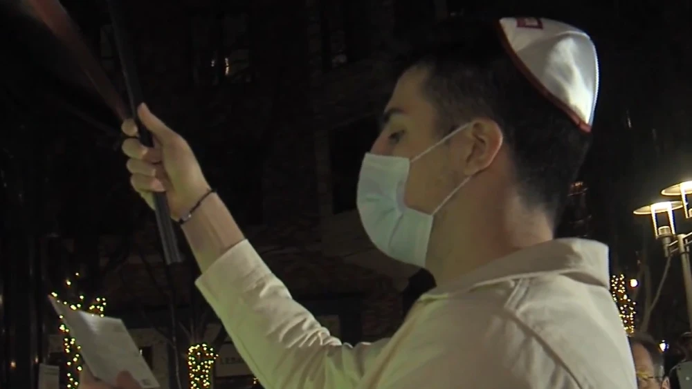 Washington Wizards player Deni Avdija lighting a menorah at a Hanukkah celebration in Rockville, Md. Source: Screenshot.