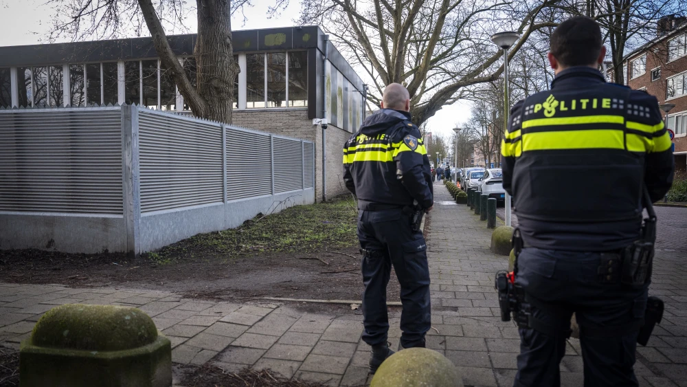 Dutch police officers stand guard near a Jewish school in Amsterdam, the Netherlands on March 16, 2026. Photo by Jeroen Jumelet / ANP / AFP via Getty Images / Netherlands OUT.
