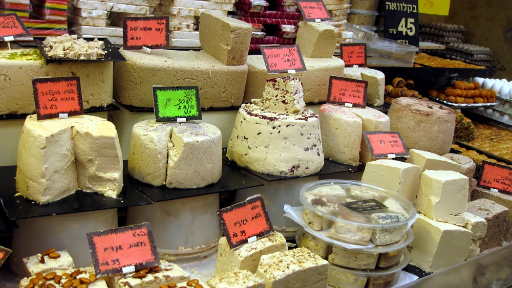An array of the many types of halvah at a stand in the Machane Yehuda outdoor market in Jerusalem. Credit: Avi Deror via Wikimedia Commons.
