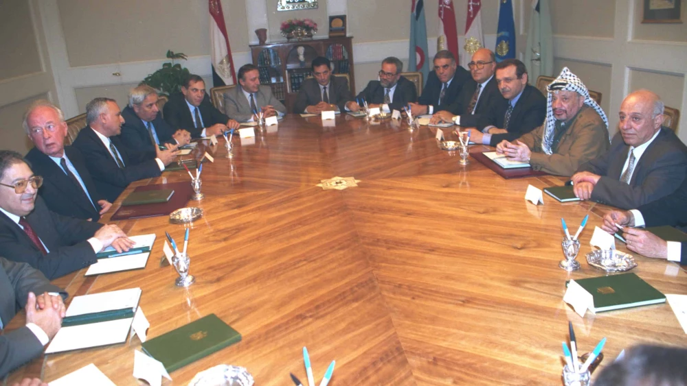 Prime Minister Yitzhak Rabin and the Israeli delegation meeting in Cairo with PLO Chairman Yasser Arafat and the Palestinian Delegation, Dec. 12, 1993. Credit: Tsvika Israeli/GPO.