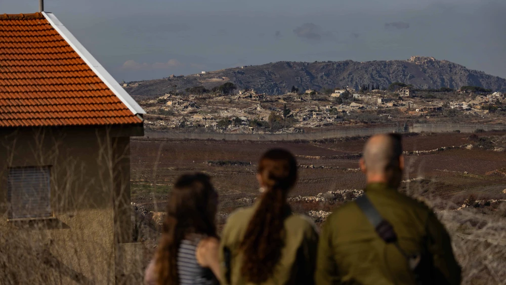 Israelis in Metula view damage from an IDF operation across the border in Lebanon, Dec. 9, 2024. Photo by Chaim Goldberg/Flash90.