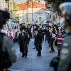 Israeli police officers clash with haredim during a protest against the enforcement of coronavirus emergency regulations in the Mea Shearim neighborhood of Jerusalem, Oct. 4, 2020. Photo by Nati Shohat/Flash90.
