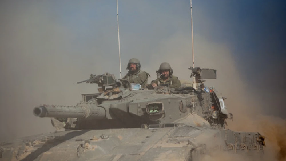 An Israel Defense Forces tank crosses through a field near the border with Gaza in southern Israel on July 21, 2014, two weeks into “Operation Protective Edge.” Photo by Yonatan Sindel/Flash90.