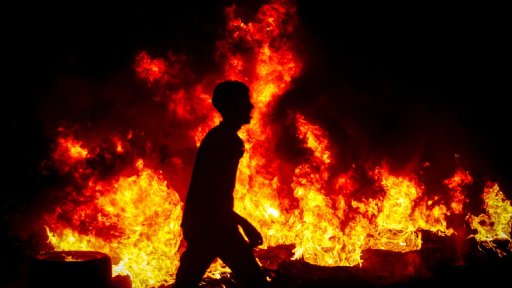 Palestinians riot on behalf of the Gilboa Prison escapees at the Huwara checkpoint near the city of Nablus, Sept. 8, 2021. Photo by Nasser Ishtayeh/Flash90.