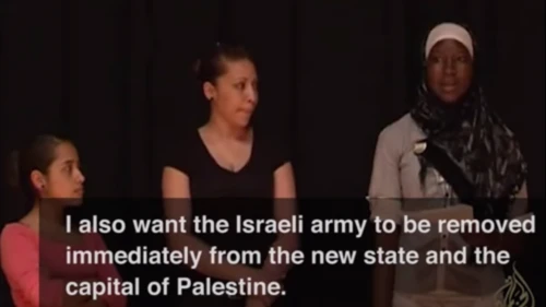 Click photo to download. Caption: During a role play exercise, a participant of Axis of Hope's "Whose Jerusalem?" workshop expresses the desire for the Israeli army "to be removed immediately from the new [Palestinian] state and the capital of Palestine." Credit: YouTube.