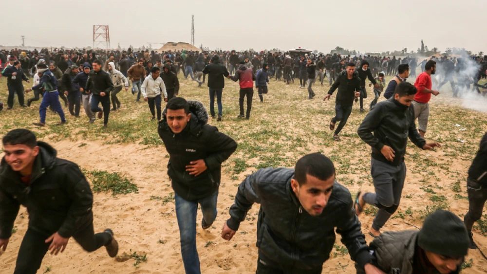 Palestinian protesters take part in a "Great March of Return" demonstration, near the Israel-Gaza border east of Rafah in the southern Gaza Strip, on March 30, 2019. Photo by Abed Rahim Khatib/Flash90.