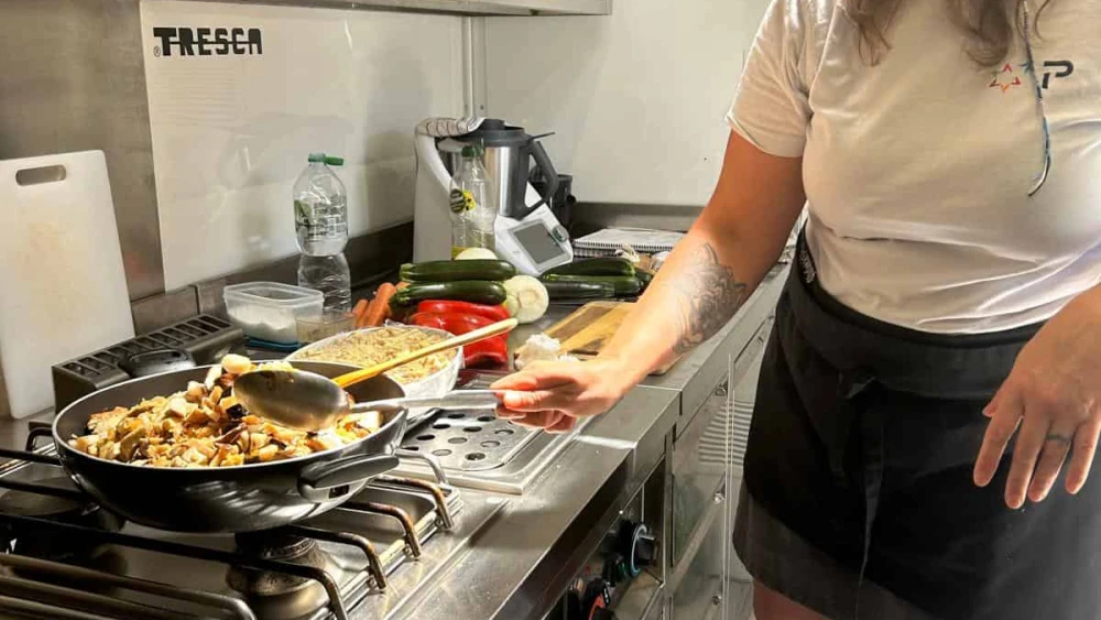 Chef Olga Belenko prepares a white mushroom turkey stew for lunch for the riders, June 28, 2024. Photo by Amelie Botbol.