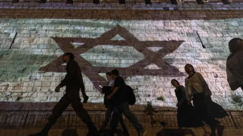 The Israeli flag is projected on the walls of Jerusalem's Old City, Nov. 7, 2023. Photo by Chaim Goldberg/Flash90.