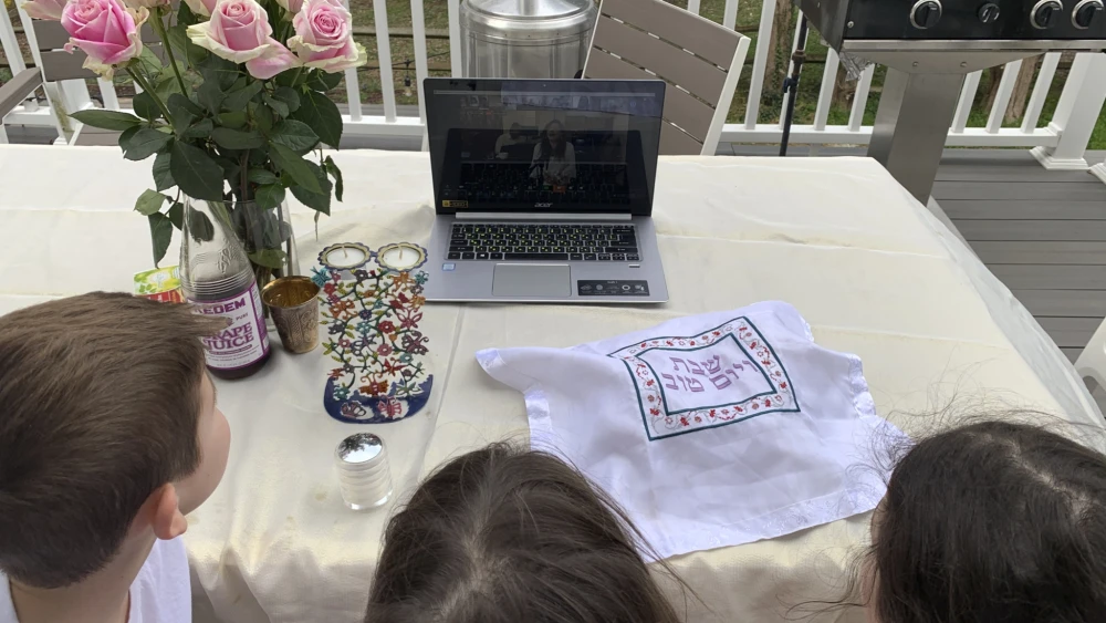 Children watch the weekly online Kabbalat Shabbat program sponsored by the Israeli-American Council, May 2020 Credit: Courtesy.
