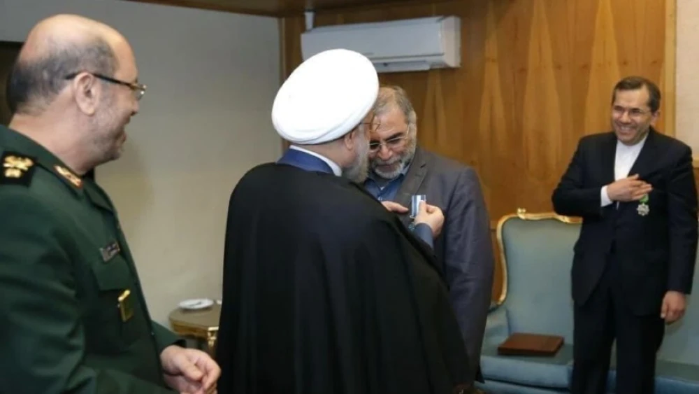 Iran’s President Hassan Rouhani pins a “second-class service” badge on IRGC Brig. Gen. Mohsen Fakhrizadeh on Feb. 19, 2016. Watching on the left is then-Defense Minister Gen. Hossein Dehqan. Source: Iranian media.