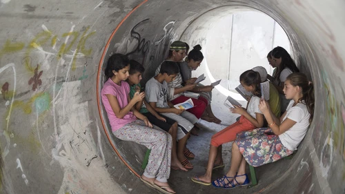 Israelis in the southern town of Nitzan pray together inside a street-level bomb shelter in anticipation of a Code Red siren for incoming rockets on the fourth day of “Operation Protective Edge,” July 11, 2014. Photo by Hadas Parush/Flash90.