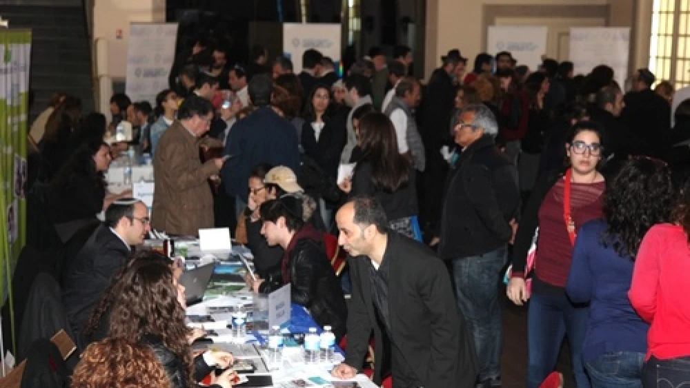 Click photo to download. Caption: An aliyah information fair in central Paris on March 30. Credit: Alain Azria.