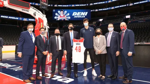 Deni Avdija (center right) poses with Israeli Ambassador to the United States Ron Dermer (center left) and other officials. Credit: WashingtonWizards.com.