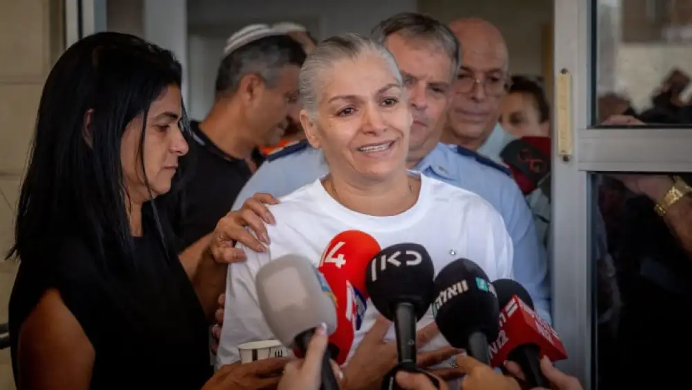 Margalit Megidish speaks to press outside her home in Kiryat Gat, Oct. 31, 2023. Photo by Yonatan Sindel/Flash90.