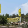 Hezbollah flags just over the border in Lebanon, July 3, 2022. Photo by Ayal Margolin/Flash90.