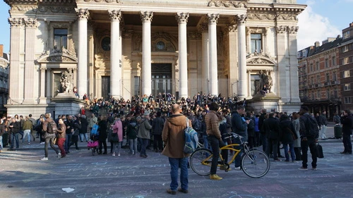 Click photo to download. Caption: A gathering in Brussels on March 22, the day that terror attacks killed 31 people in that city. Credit: Miguel Discart via Wikimedia Commons.